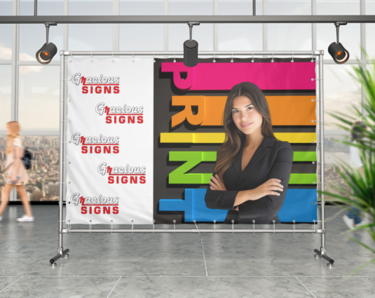 horizontal-banner-mockup-placed-against-a-window-with-a-city-view-983-el